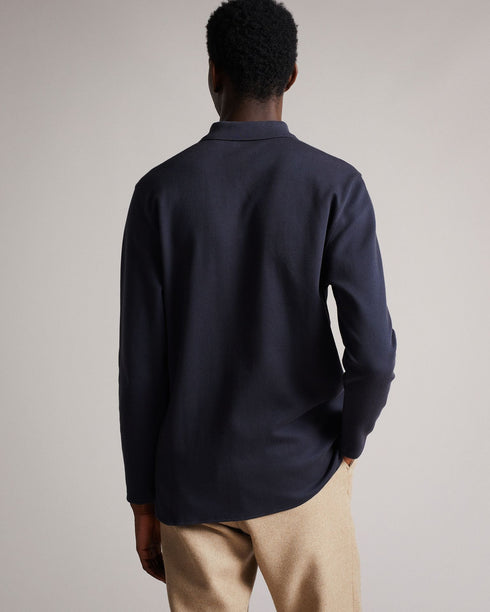 BADDOW-Tops-Hey, smooth operator. The BADDOW polo shirt is crafted from solid cotton twill, detailed with a buttoned collar and embroidered logo at the sleeve. Classic and comfy – it's perfect shirt for days in the office. The fabric of this product is made of organic cotton. Organic cotton has a proven lower environmental impact than conventional cotton, as it reduces water usage, greenhouse gas emissions, and eliminates the use of harmful chemicals in the farming process. Twill polo shirt Made from cott